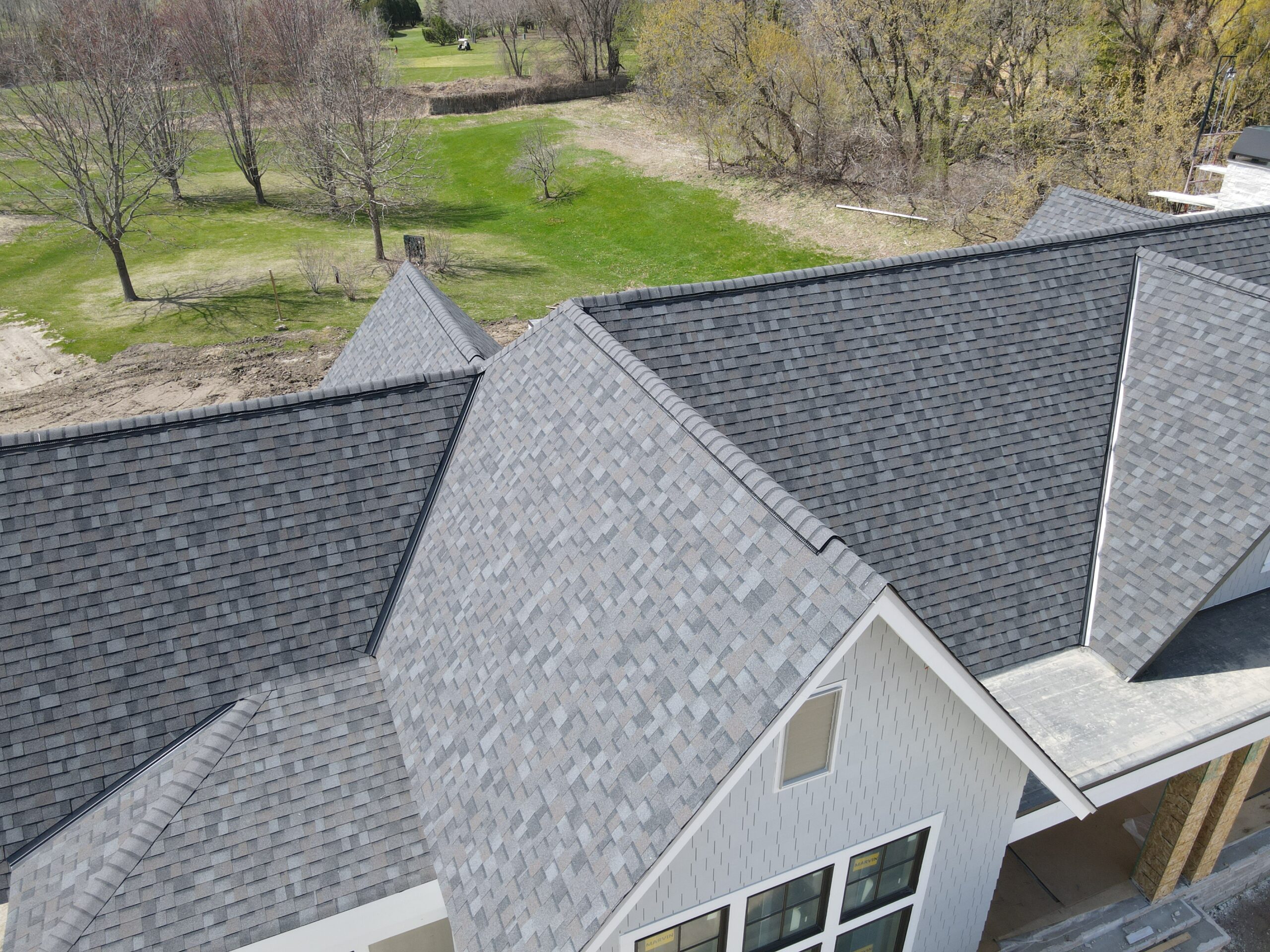 Newly installed asphalt shingle roof on a new home
